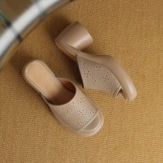 Light beige comfortable women's Crocs with perforated design and block heel. Perfect for casual or work wear, combining durability with style.