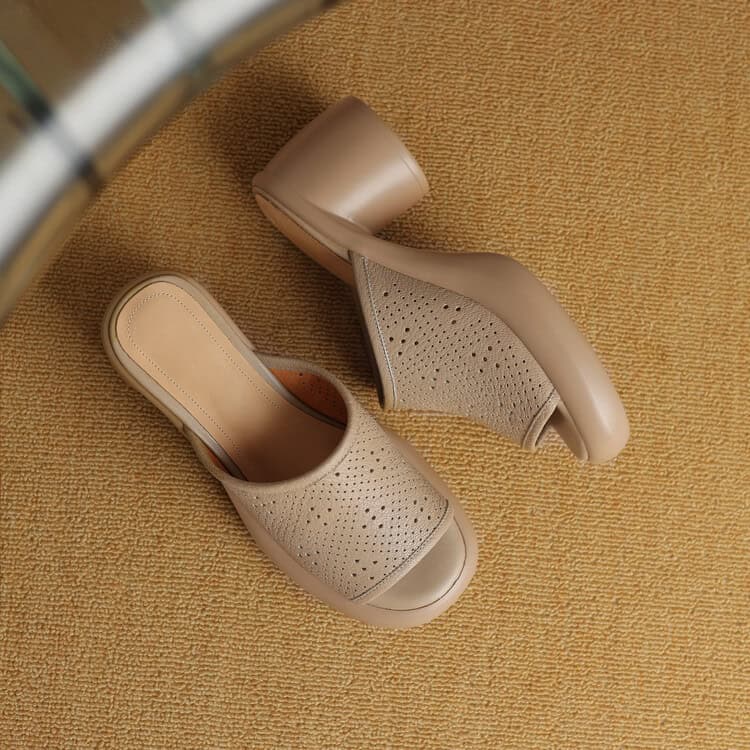 Light beige comfortable women's Crocs with perforated design and block heel. Perfect for casual or work wear, combining durability with style.