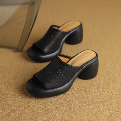 Comfortable black open-toe high heel shoes with perforated design for women. Perfect for casual and formal occasions, combining elegance with comfort.