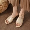 Comfortable beige slide sandals showcasing elegant design, perfect for casual or dressy occasions. High-quality materials ensure durability and comfort.