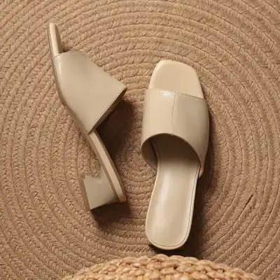Comfortable beige slide sandals with a chunky heel, perfect for casual or dressy occasions, available at Monalisa Store for women’s footwear needs.