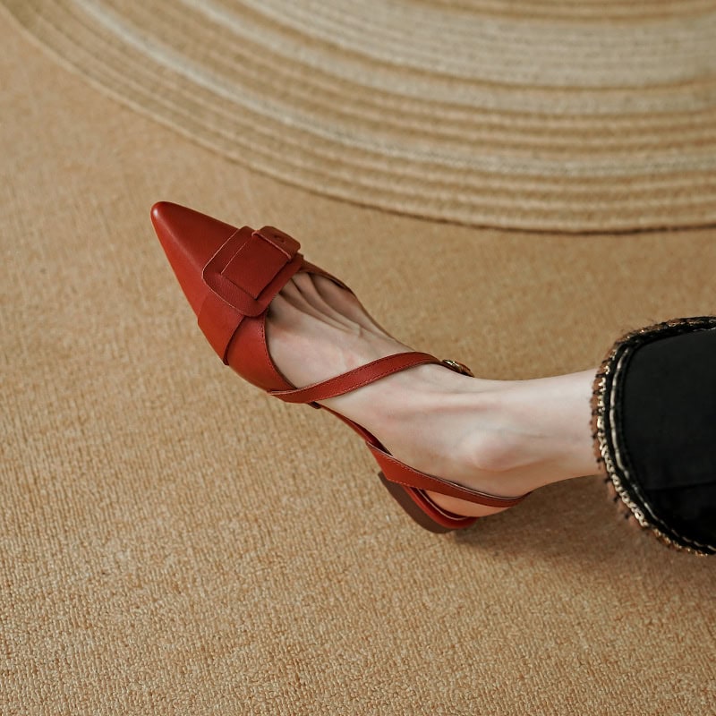 Elegant red pointed toe high heel shoe with ankle strap, perfect for fashionable women.