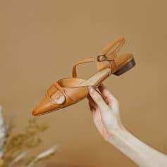 High-quality tan leather fashionable sandal with a pointed toe and ankle strap, perfect for stylish women’s footwear.