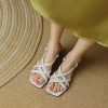 Stylish white strappy women's high heel sandals for summer and casual wear.