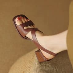 Elegant brown leather sandal with block heel, open toe design, and adjustable strap, ideal for summer fashion. Shoes from Monalisa Store for modern, stylish footwear.