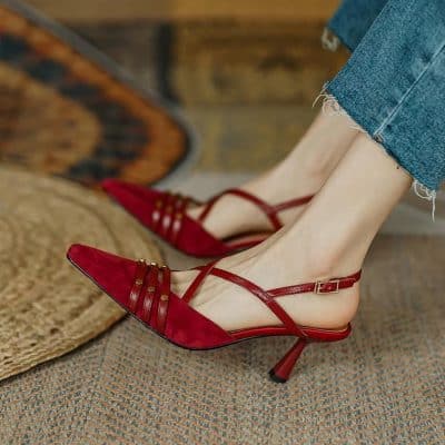 Stylish red pointed-toe high heels with ankle straps perfect for fashion-forward women. Crafted with quality materials for comfort and chic appeal.