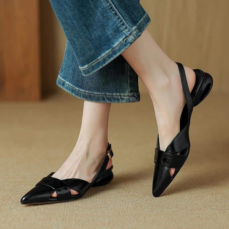 Elegant black optic flats for women with pointed toes and strap details, perfect for daily wear and stylish outfits. Comfortable and trendy footwear from Monalisa Medical.