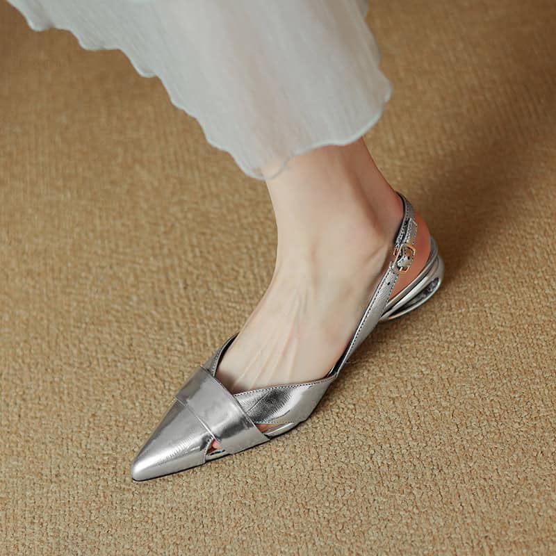 Luxurious silver pointed toe slingback shoe with a stylish buckle, perfect for fashion-forward women and special occasions.
