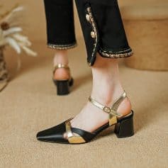Stylish black and gold high-heeled shoes with ankle straps for women, ideal for fashion-forward outfits and special events. Discover quality footwear at Monalisa Store today.
