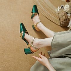 Elegant green and gold high heel shoes with ankle straps, perfect for fashion-forward women. Ideal for special occasions, adding a touch of sophistication to your wardrobe.