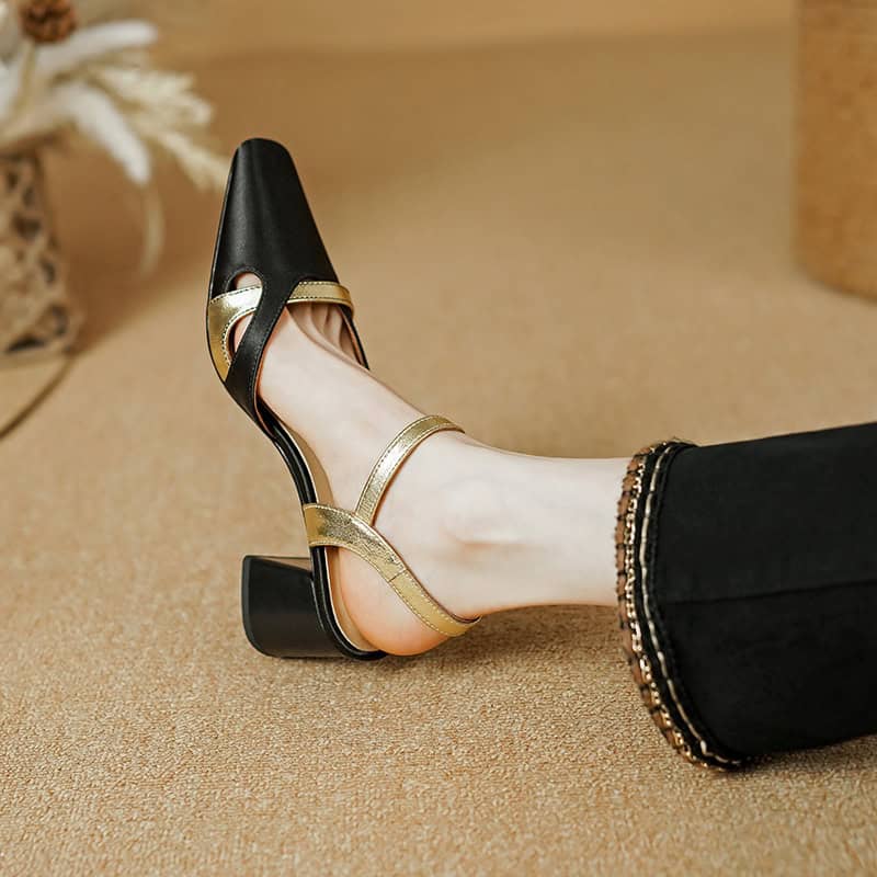 Luxury women's fashion shoe featuring black and gold accents, stylish and comfortable for special occasions or daily wear.