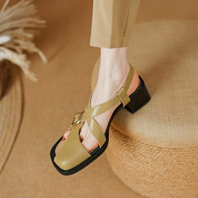 Stylish beige sandal with adjustable buckle, block heel, and comfortable design, perfect for fashionable everyday wear. Great for those seeking stylish and supportive footwear options.