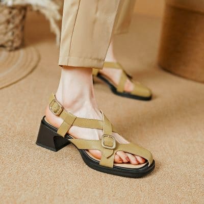 Stylish beige strappy open-toe sandals with a block heel and adjustable buckle, perfect for summer fashion and comfortable wear.