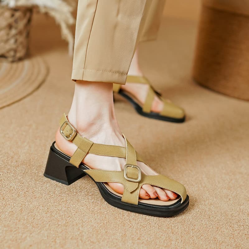 Stylish beige strappy open-toe sandals with a block heel and adjustable buckle, perfect for summer fashion and comfortable wear.