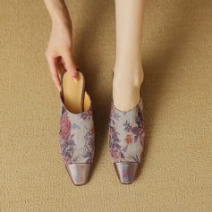 Elegant floral-patterned slip-on shoes for women, featuring a pointed toe and comfortable fit, perfect for fashion-forward individuals seeking stylish footwear.