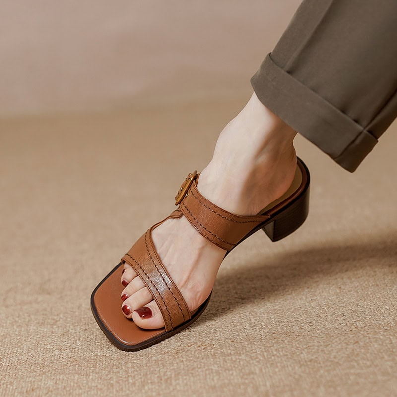 Elegant brown leather sandals for women, featuring a comfortable block heel, adjustable ankle strap, and fashionable design perfect for everyday wear or special occasions.