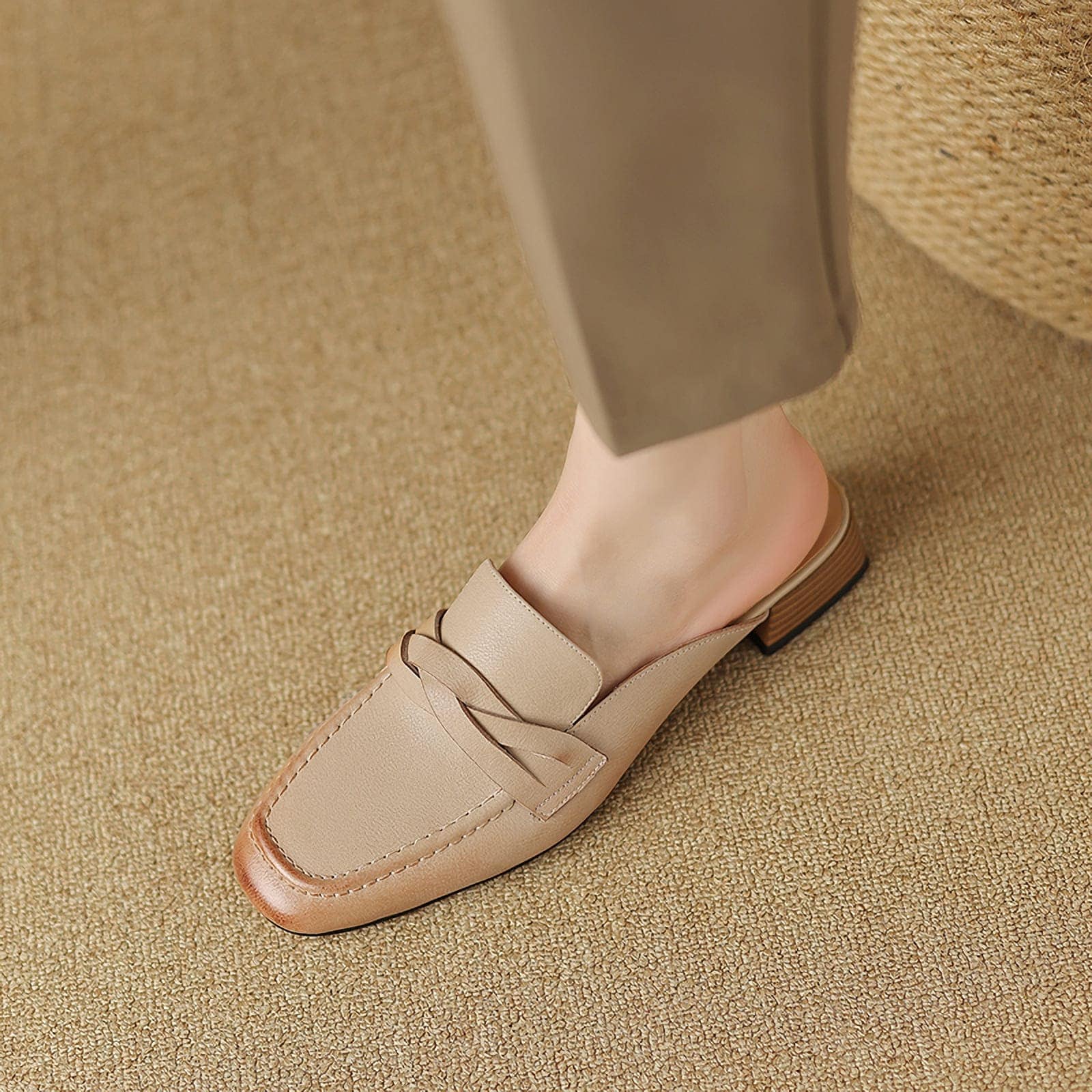 Comfortable beige leather shoe with lace-up design and block heel, suitable for professional and casual settings, offering style and support for all-day wear.