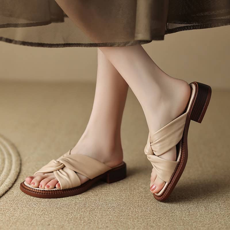 Stylish beige slip-on sandals with twisted knot detail and block heel, ideal for women's casual summer wear. From Monalisa Store, combining comfort and fashion effortlessly.