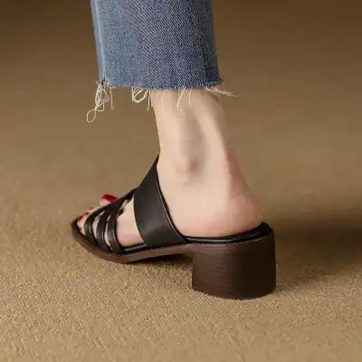 Comfortable black women's block heel sandal with strappy design for versatile style.