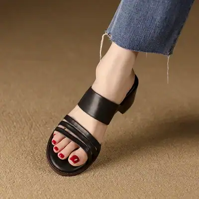 Elegant black open-toe sandal with multiple straps, perfect for women's casual or dressy occasions, offering comfort and style.