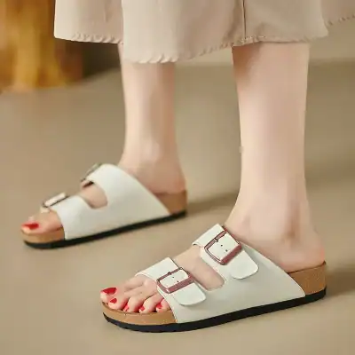 Comfortable women's slide sandals with adjustable buckles and cushioned footbed, perfect for casual wear.