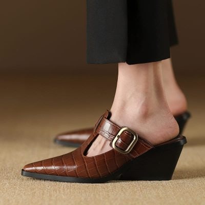 Elegant brown wedge sandals with a crocodile pattern and large buckle, perfect for stylish footwear and sandals enthusiasts.