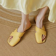 Stylish yellow slip-on sandals featuring wide straps, perfect for casual and summer wear, available at Monalisa Store for trendy footwear options.