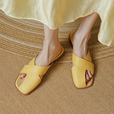Stylish yellow slip-on sandals featuring wide straps, perfect for casual and summer wear, available at Monalisa Store for trendy footwear options.