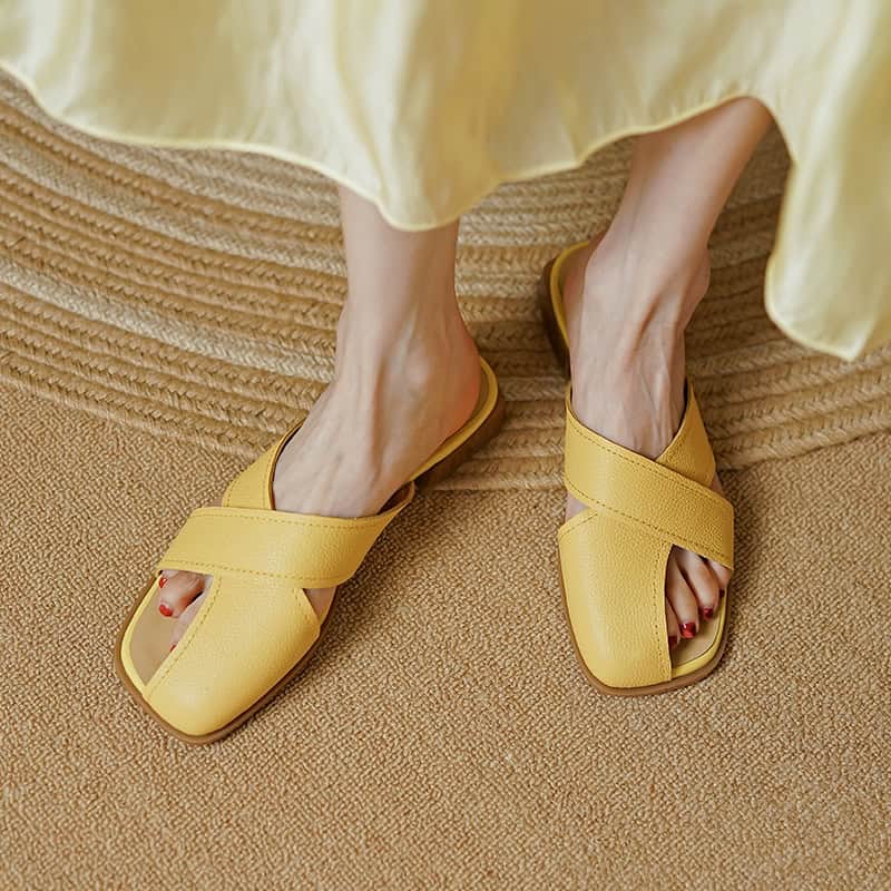 Stylish yellow slip-on sandals featuring wide straps, perfect for casual and summer wear, available at Monalisa Store for trendy footwear options.
