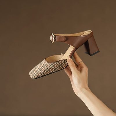 Stylish women's heeled shoes with houndstooth pattern and brown leather ankle strap featuring a decorative buckle, perfect for fashionable everyday or special occasions.