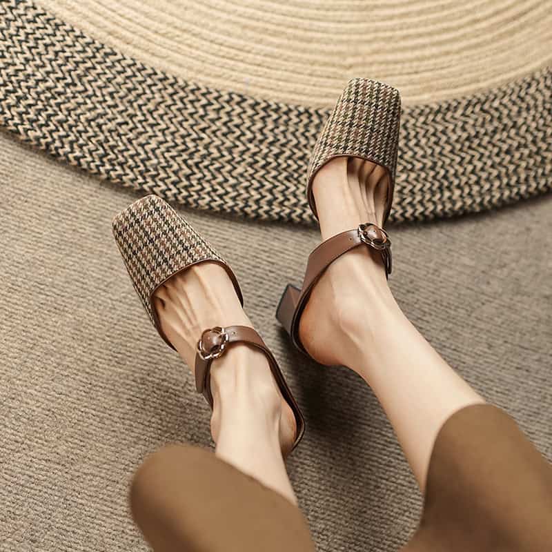 Elegant women’s brown heels with stylish buckle detail, featuring comfortable leather straps, perfect for office or casual wear.