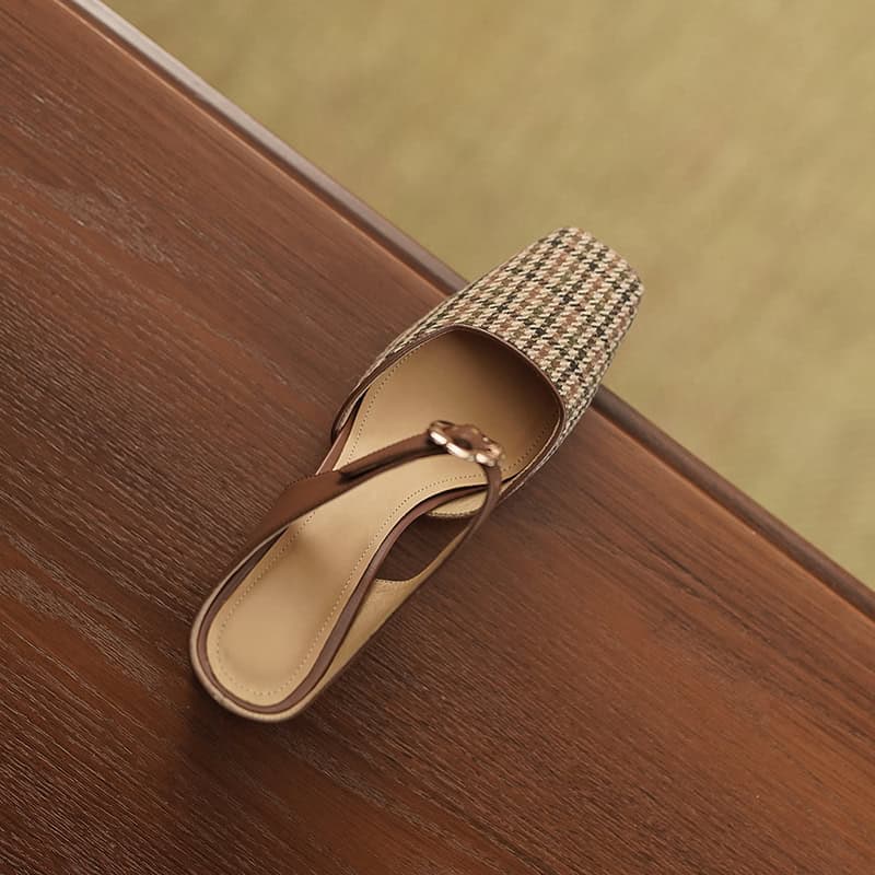 Comfortable beige and brown houndstooth pattern slip-on mule shoe with a flat sole, ideal for casual and chic eyewear store staff or customers.