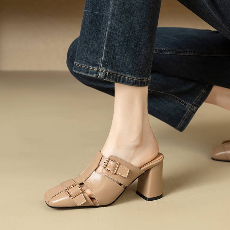 Elegant beige mule heels with buckle straps, ideal for stylish outfits. Perfect for formal events or casual chic, adding a sophisticated touch to your wardrobe.