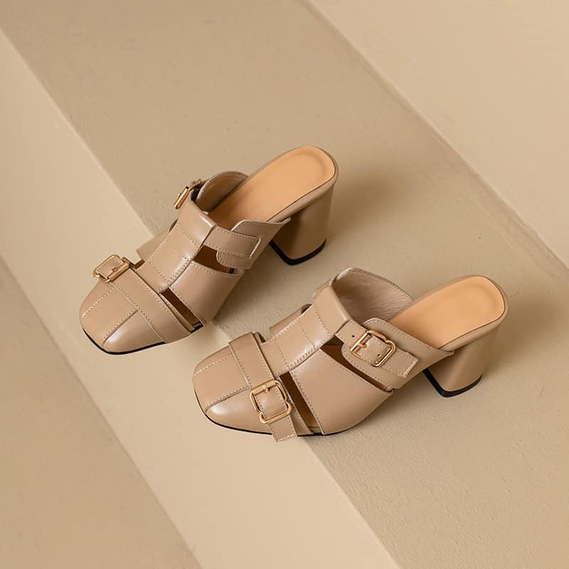 Luxurious beige women's slip-on heels with decorative buckles, ideal for fashion-forward looks. Designed for comfort and style, these chic shoes are perfect for both casual and formal events.