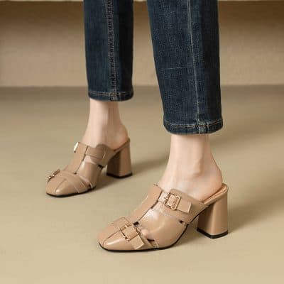 Elegant beige women's sandals with buckle details, perfect for fashionable footwear and stylish outfits.