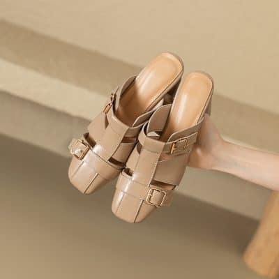 Stylish beige sandals with adjustable straps and buckle details, perfect for casual summer wear and comfortable all-day style.