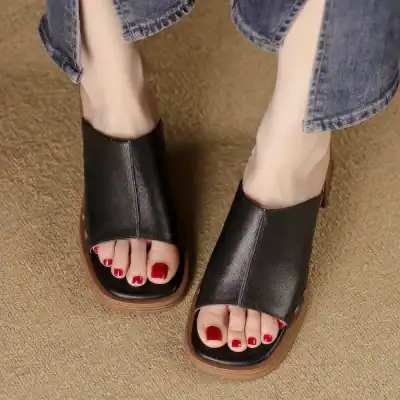 Comfortable black open-toe sandals ideal for casual and fashion-forward looks. Perfect for daily wear, available at Monalisa Store for modern women seeking trendy footwear options.