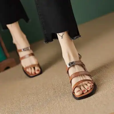 Chic women's sandals featuring multiple straps and a buckle detail, ideal for summer or casual wear, found at Monalisa Store.