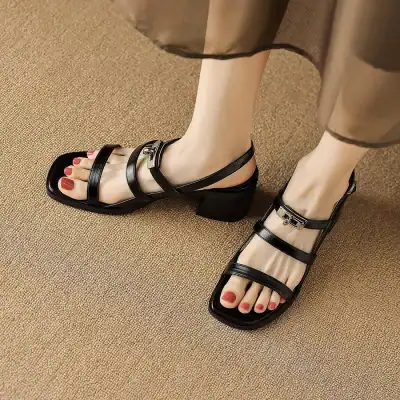 High-quality black strappy sandals with a block heel, perfect for fashionable women seeking stylish footwear options.