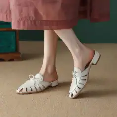 Elegant white leather shoes with bow detail, open-toe design, low chunky heel, perfect for summer or casual style, available at Monalisa Store for women.