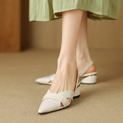 Elegant cream-colored women's high heels with pointed toes and comfortable block heels, perfect for formal occasions and office wear.