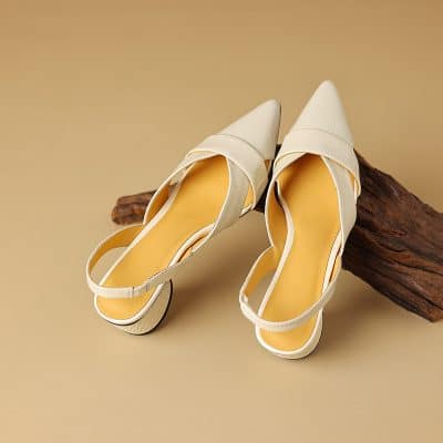 Fashionable white high-heeled shoes with pointed toes, perfect for special occasions or everyday style, available at Monalisa Store for trendy footwear lovers.