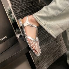 Comfortable, stylish silver sandal with detailed bead embellishments, ideal for summer outings and fashion-forward looks. Perfect for both casual and dressy events.