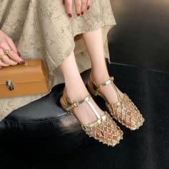 Luxury women's sandals with gold metallic finish, open-toe design, and intricate strap details. Ideal for fashion-forward individuals seeking stylish footwear from Monalisa Store.