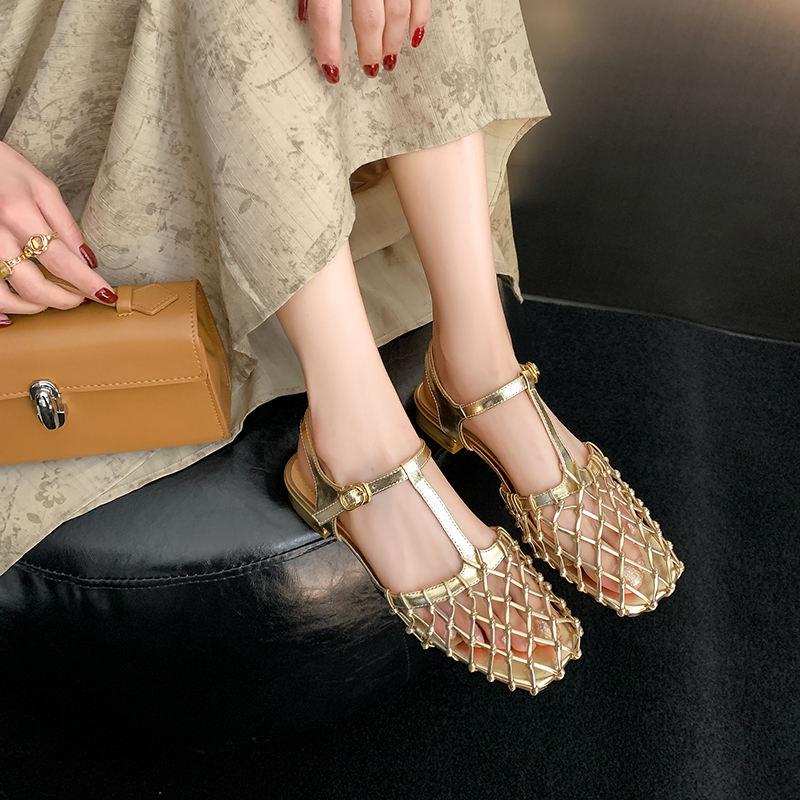 Luxury women's sandals with gold metallic finish, open-toe design, and intricate strap details. Ideal for fashion-forward individuals seeking stylish footwear from Monalisa Store.