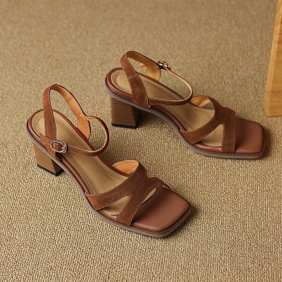 Stylish brown open-toe block heel sandals with ankle strap and buckle, perfect for fashion-forward women seeking comfort and style. Ideal for casual or formal occasions.