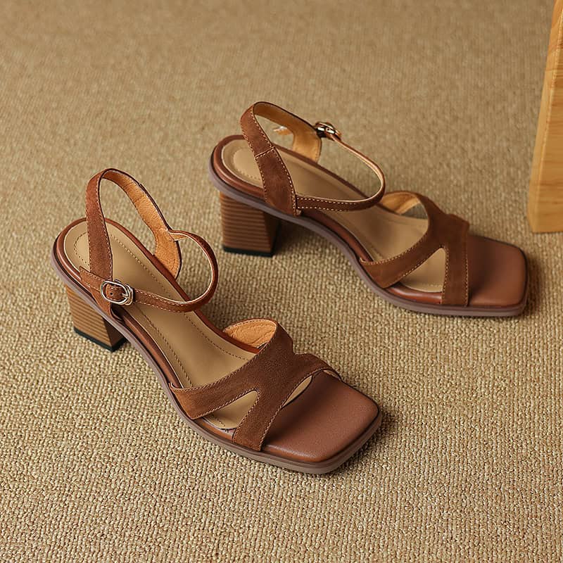Stylish brown open-toe block heel sandals with ankle strap and buckle, perfect for fashion-forward women seeking comfort and style. Ideal for casual or formal occasions.