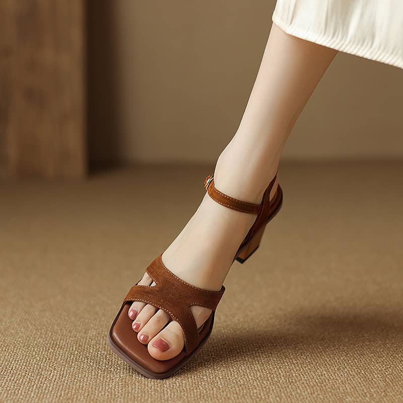 Elegant brown open-toe high-heel sandals with ankle straps, perfect for fashion-forward women seeking stylish footwear options.