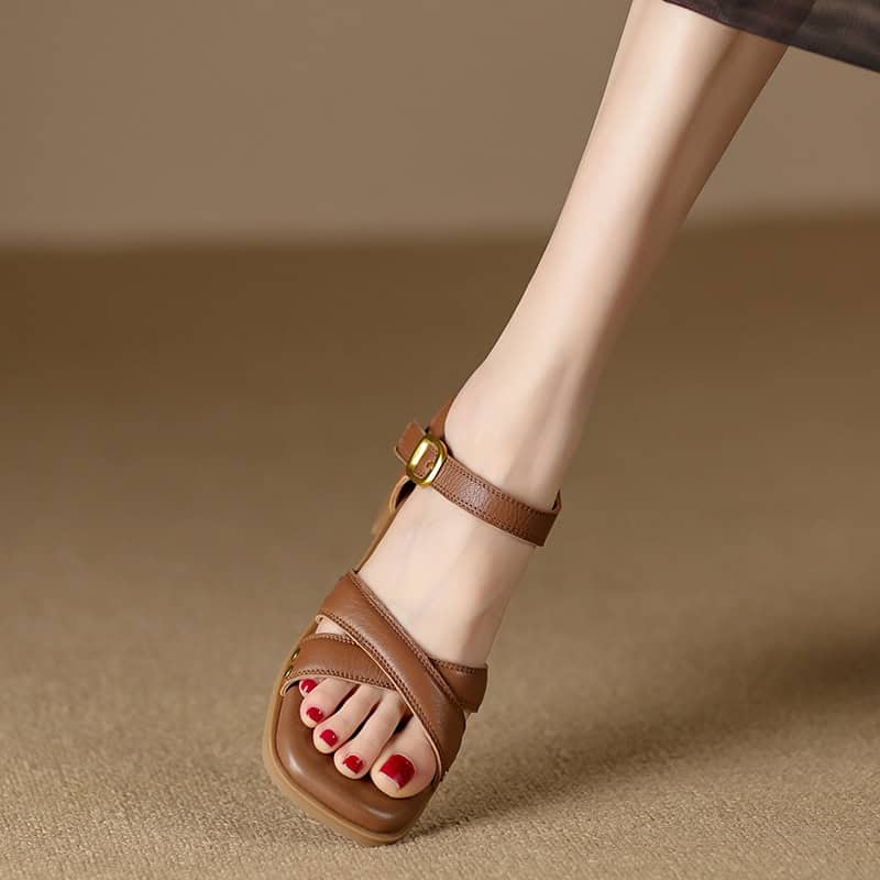 High-quality brown leather sandals with adjustable ankle strap and comfortable design, perfect for fashionable women's footwear.