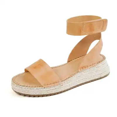 Comfortable beige espadrille sandal with ankle strap for stylish summer footwear. Perfect for casual outings, combining fashion and comfort.